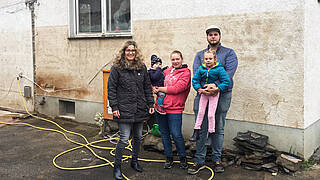 Family Deißler in front of their house in Ahrtal